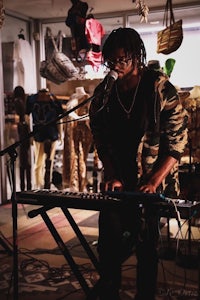 a man playing a keyboard in a store